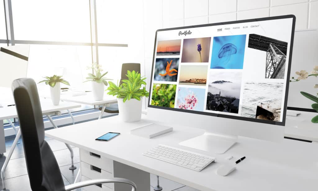 Computer,With,Portfolio,Website,On,Screen,3d,Rendering. Computer,With,Portfolio,Website,On,Screen,3d,Rendering.